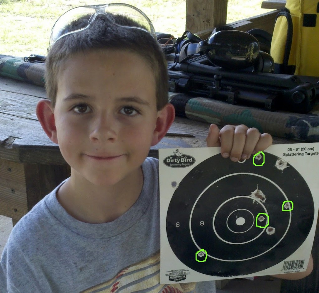 Riley with his target after his first day on the firing range