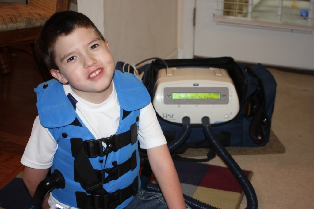 Caden using The Vest by Hill-Rom to fight pneumonia